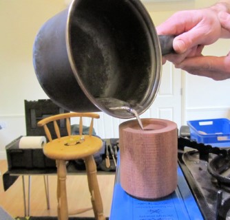 Pouring the moulten pewter into the mould